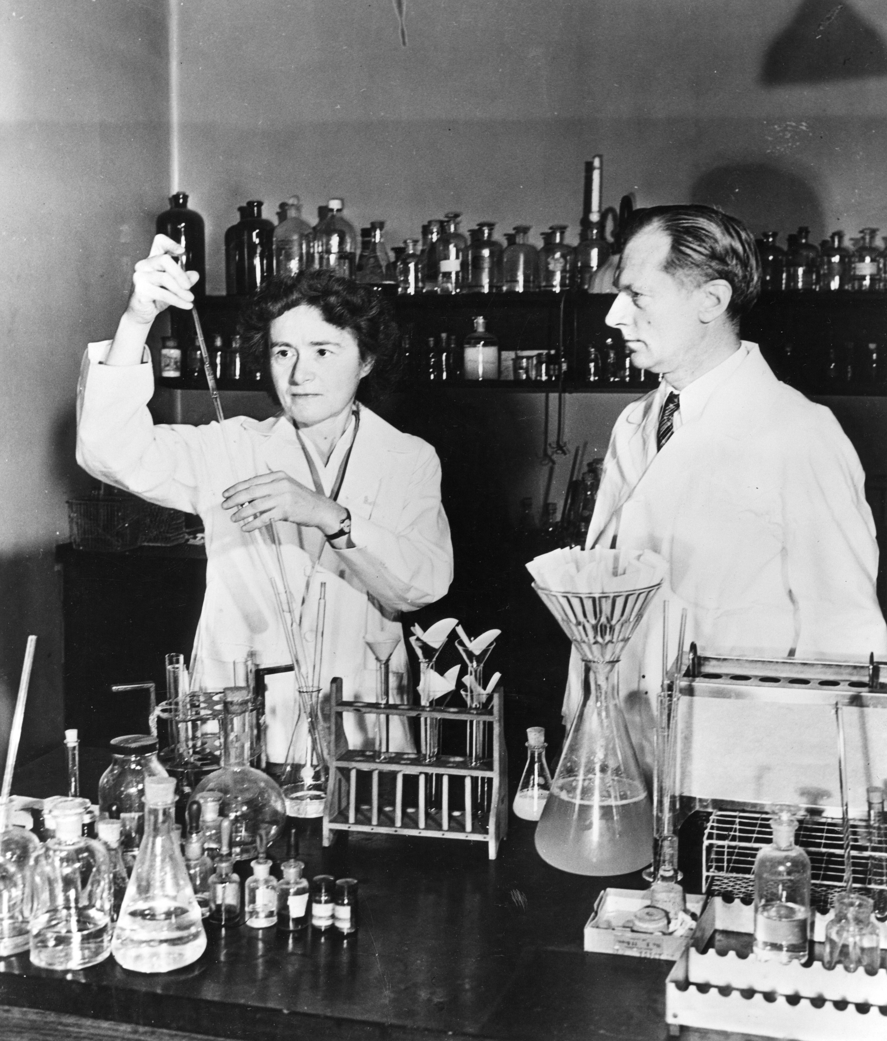 Female and male scientists working together in a lab
